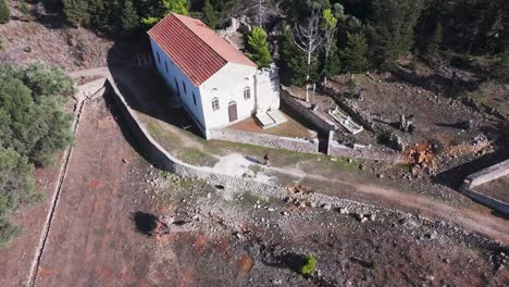 aerial view of a historical church and ruins in a greek village