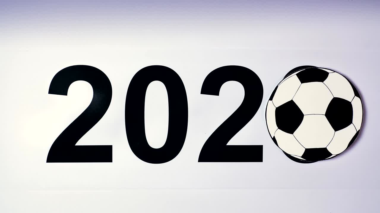Illustrazione, Capodanno, mano maschile posata sul tavolo su pallone da calcio, 2020