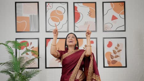 Indian-woman-pointing-upwards-product-space