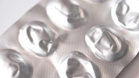 empty medical pills containers on white background, medical themed texture