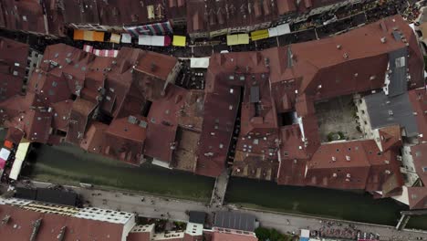 City-Building-Rooftops-of-Old-Town,-Annecy---Tourism-Travel-Destination-in-France,-Top-Down-Aerial