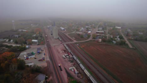 Misty-autumn-view-of-cereal-silos-and-storage-facilities