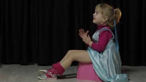 Little-girl-sitting-on-the-potty-and-watching-TV