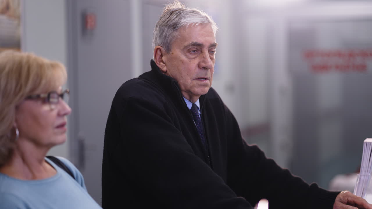 Older man and woman in an office setting