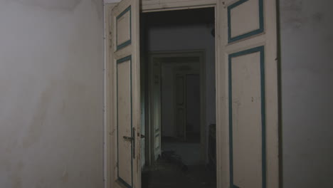 interior doors in an old abandoned house - pov