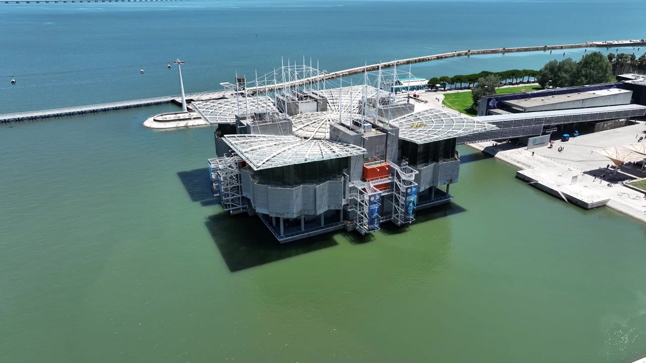 Contemporary Architecture Of Lisbon Oceanarium Built Over The Tagus River At Park Of The Nations In Portugal. aerial