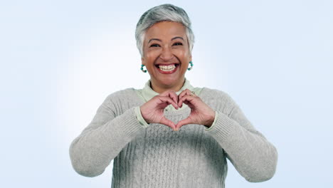Heart,-hands-and-face-of-happy-senior-woman