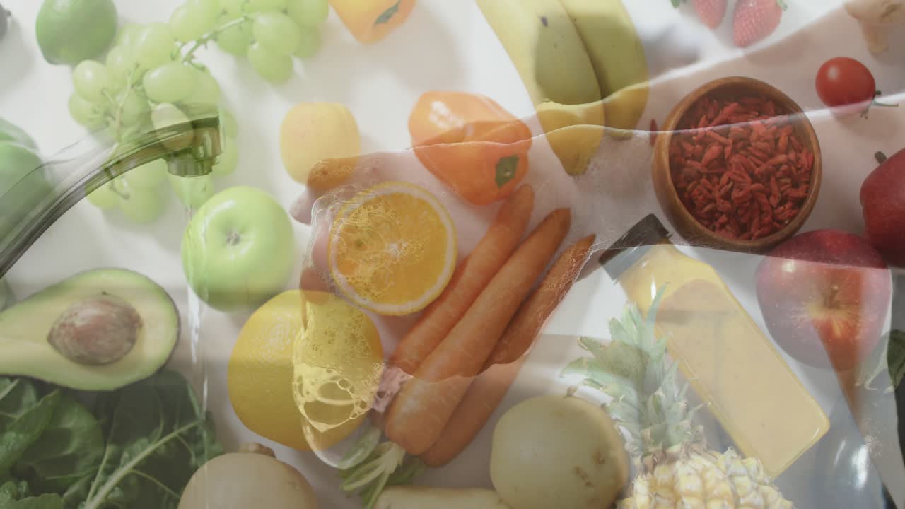 Forearms entering frame above countertop rearranging produce for food preparation tutorial