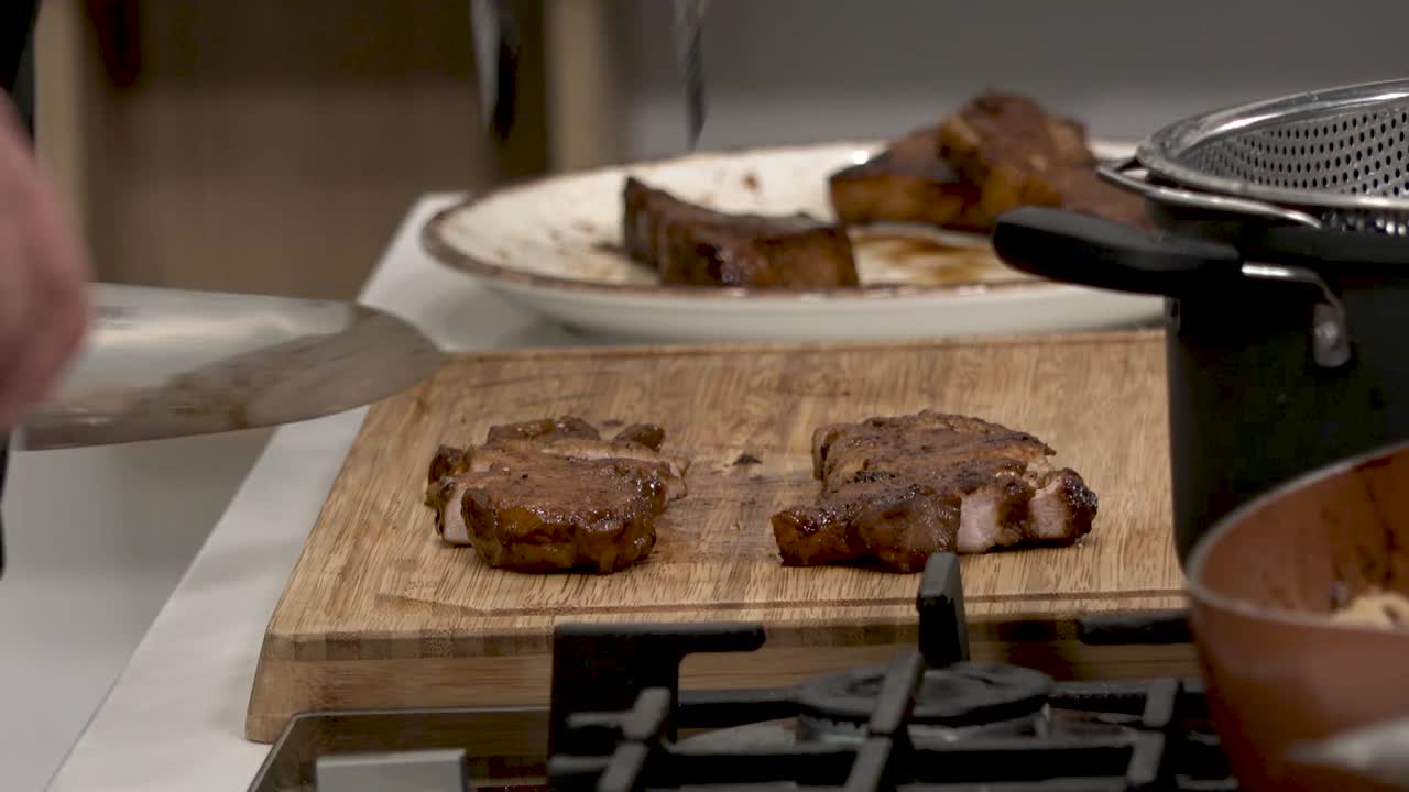 A chef skillfully grills a steak, then expertly slices it into tender pieces. Watch as different cooking techniques enhance flavor and present a tasty dish