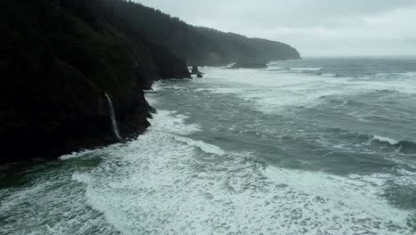 us, oregon, tillamook, cape lookout, 2025-02-19 - drone view of a tidefall (coastal waterfall) at cape lookout on the oregon coast in winter.