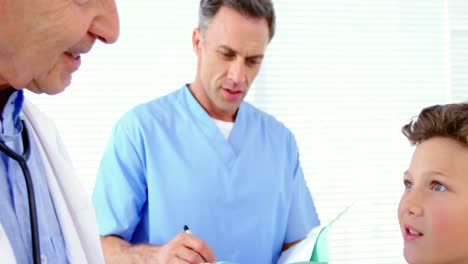 male doctor checking blood pressure of patient