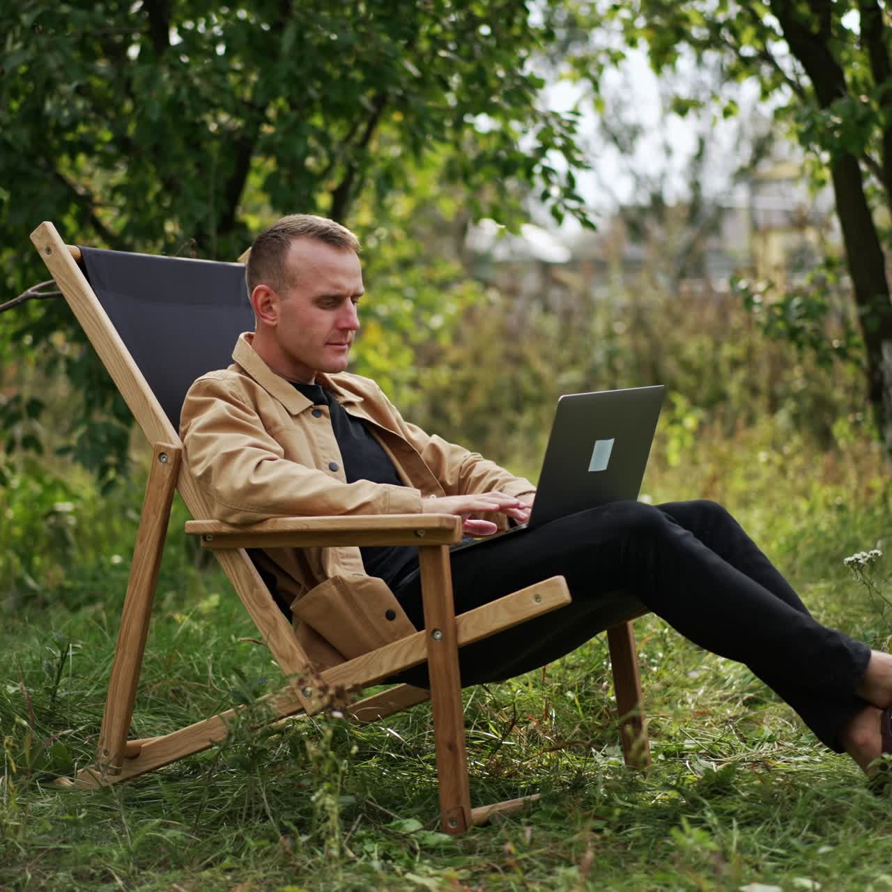 Lifestyle business manager working outdoor. Emotional handsome man with laptop