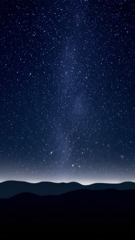 starry night sky over mountain silhouette