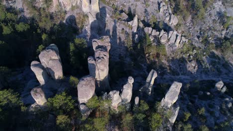 aerial tilt up shot of rock formations in el valle de loss monies, copper canyon region, chihuahua