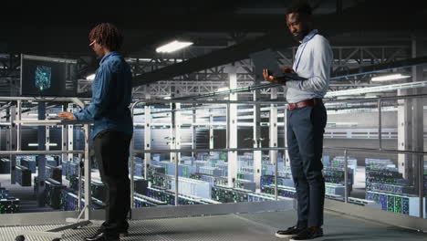 data center coworkers use laptop to monitor neural network llm visualization