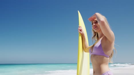 woman looking away on the beach