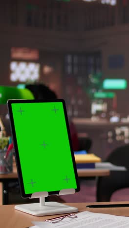 vertical video young female student studies for her upcoming exams with green screen