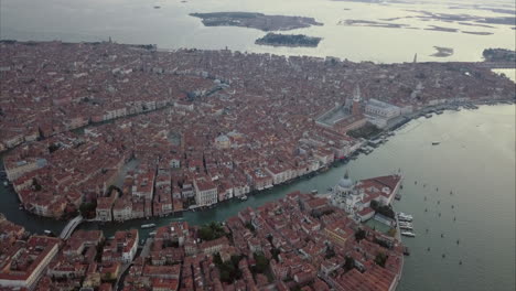 wide aerial ascending shot of san marco area from above at dusk, venice, italy