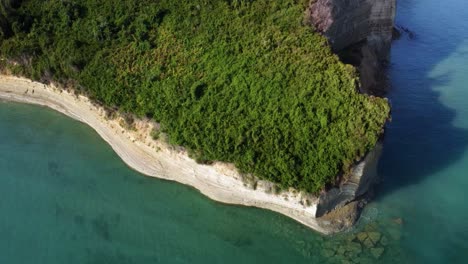 coastline aerial view of corfu island with natural scenic forest and seascape rocky cliff formation