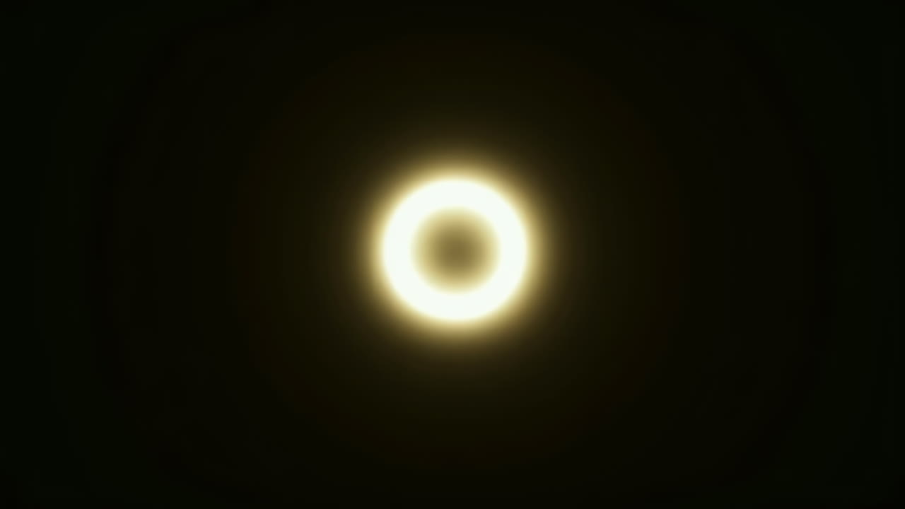 Abstract Golden Light Ring Fading into Darkness