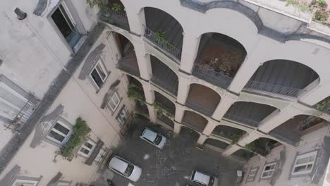 aerial footage slowly moving to the left of the palazzo dello spagnolo in naples, italy