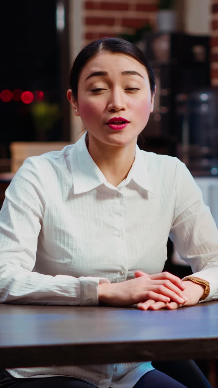 Vertical video POV of human resources employee conducting interview with candidate in videocall