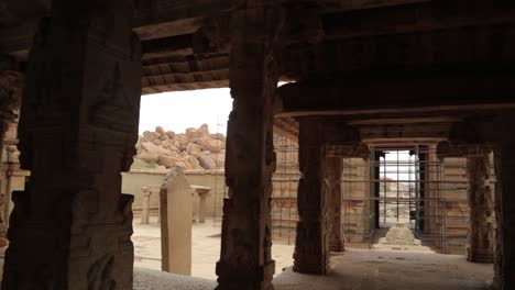 pan view rock piller architecture of ruined krishna temple from the top matanga of the hill near hampi, india