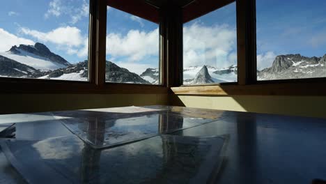 Alaskan-time-lapse-of-clouds-passing-over-mountain-peaks-from-within-an-alpine-hut