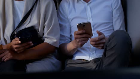 commuters using mobile phone and digital tablet while travelling in bus 4k