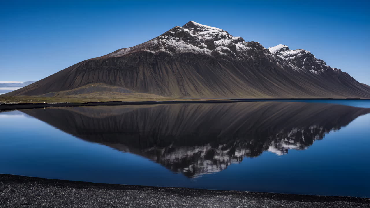 Vestrahorn Mountain and Its Reflection on Black Sand Beach, Iceland