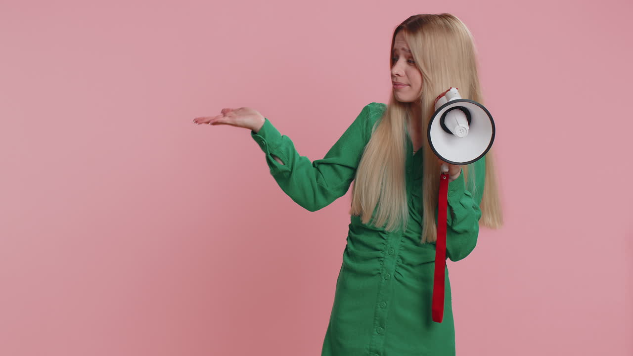 Woman scream in megaphone announces discounts sale pointing empty advertising area banner logo