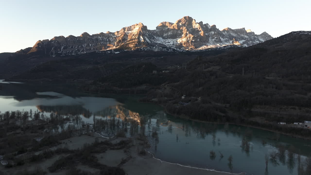 Sunrise over Alpine Lake and Mountains