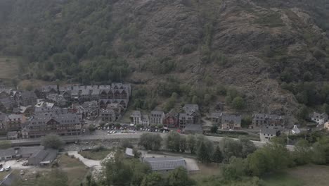 A-breathtaking-drone-pan-reveals-a-picturesque-Spanish-town-nestled-among-the-stunning-Pyrenees-mountains