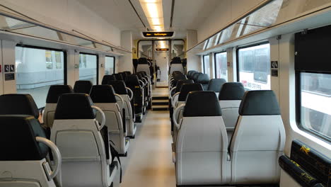 the inside of a swiss train waiting to depart. static shot.