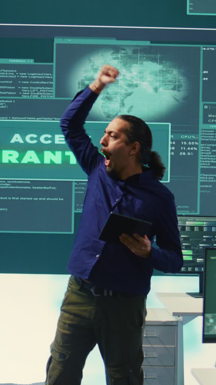 Programmer Celebrates Access Granted on Large Digital Screen
