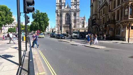 police car driving through busy london intersection