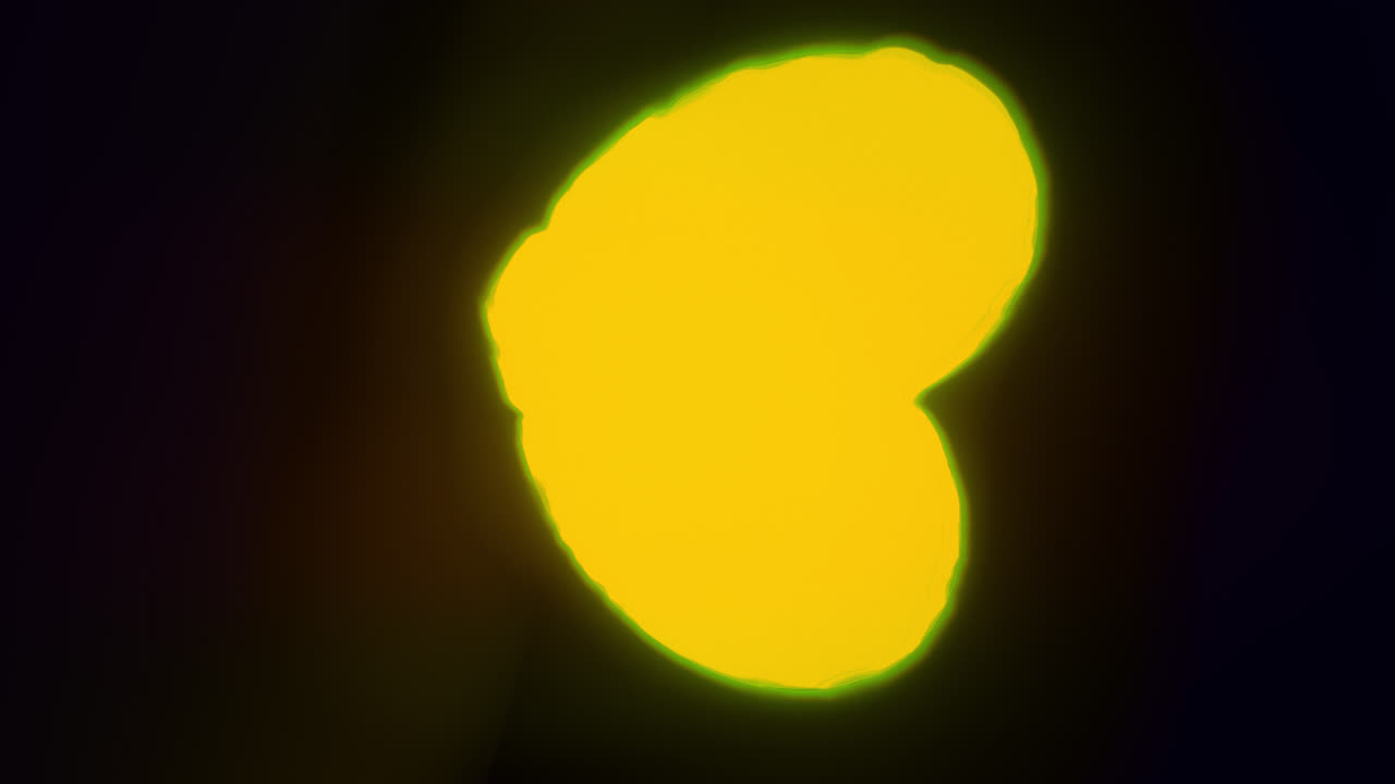Yellow energy heart shapes on a dark background