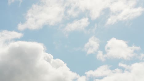 timelapse view of bright heaven clouds rolling on blue sky, bright sunlight