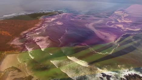 digital composition of waving germany flag against aerial view of the sea waves