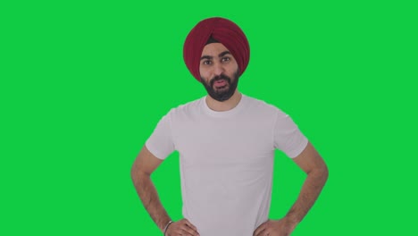 happy sikh indian man getting a surprise green screen