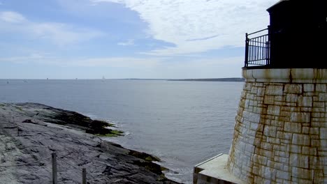 a small lighthouse near newport rhode island looking out into the entrance of the bay