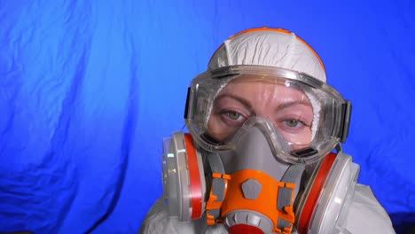 scientist virologist in respirator. woman close up look, wearing protective medical mask. concept health safety n1h1 coronavirus epidemic 2019 ncov.