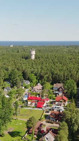 aerial view of colorful rooftops in jurmala residential forest neighborhood, vertical