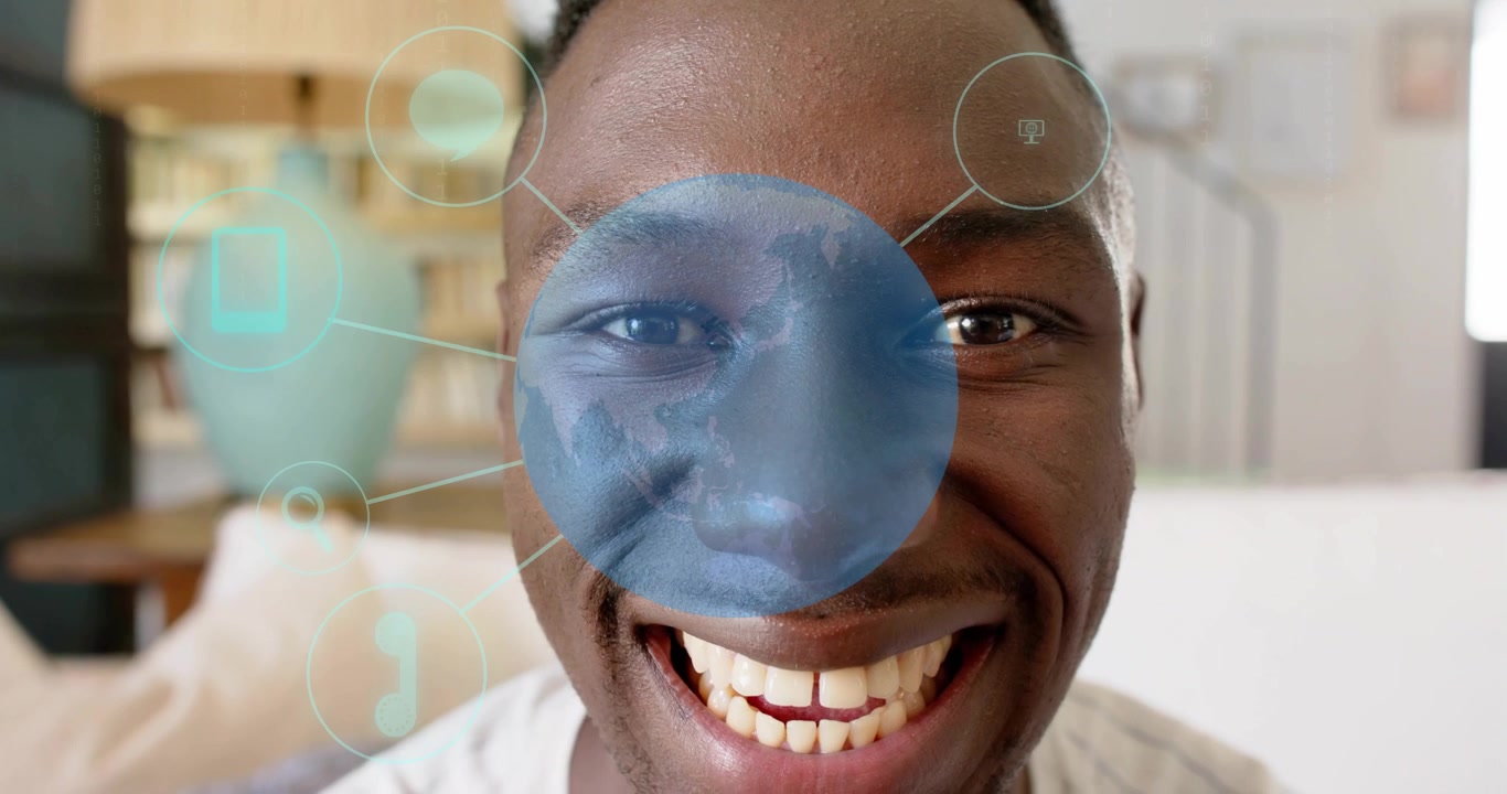 Man sitting couch activating circle overlay opening eyes as digital icons radiating for technology