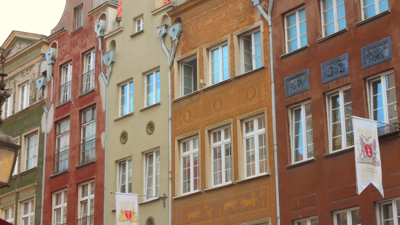 Pan shot of colorful and historic architecture in downtown Gdansk, Poland.