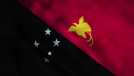 papua new guinea flag waving in the wind. national flag of papua new guinea. sign of papua new guinea seamless loop animation. 4k