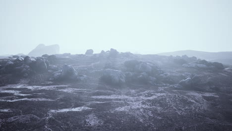 scenic landscape with beautiful snow mountains in low clouds