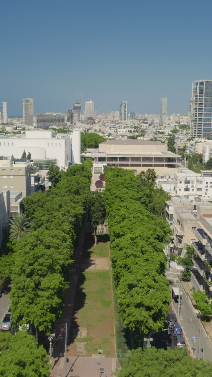 Rothschild blvd to Habima Theater new building In Tel Aviv and Menashe Kadishman statue - Vertical video