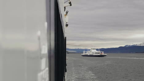 view of ferry passing behind ferry