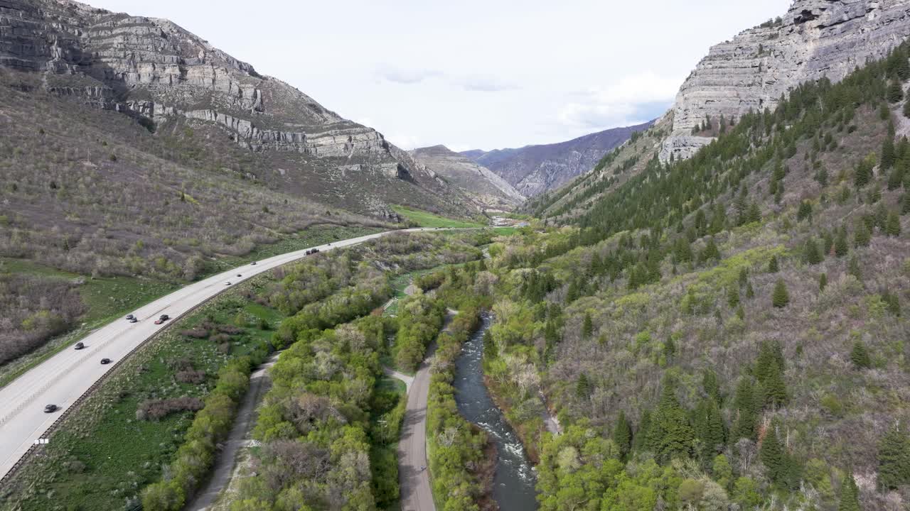 Aerial track of highway through American Fork Canyon near Bridal Veil Falls, Utah during spring